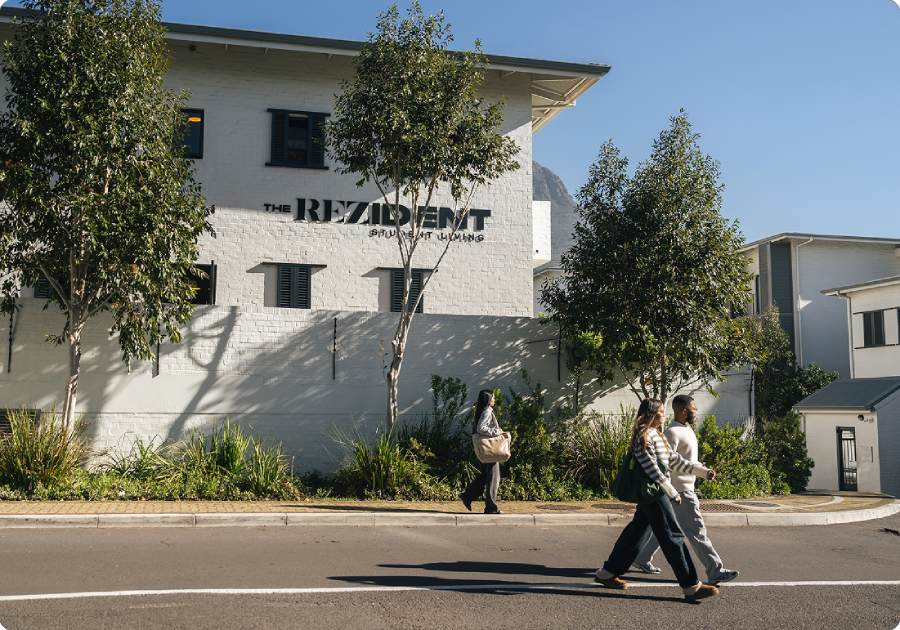 The ReZident residence with students walking outside