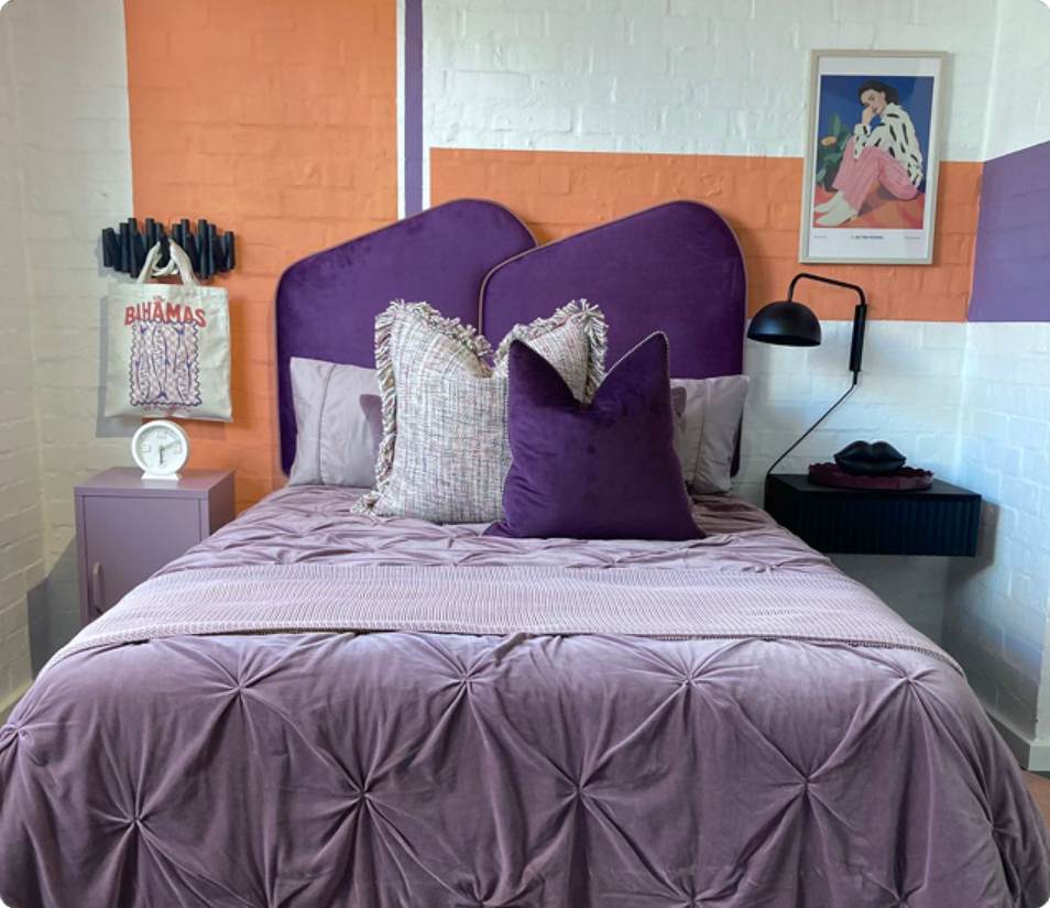 Verreweide two-bedroom unit, purple bedding and headboard.