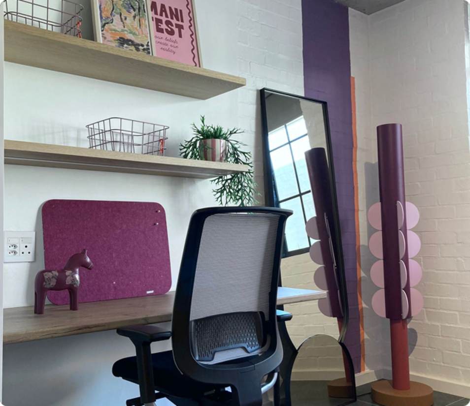 Verreweide two-bedroom unit, purple bedroom desk and bookshelves.