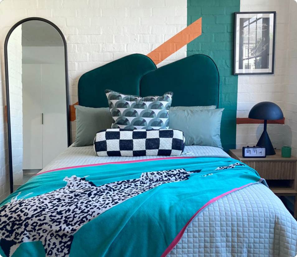 Verreweide two-bedroom unit, teal bedding and headboard.